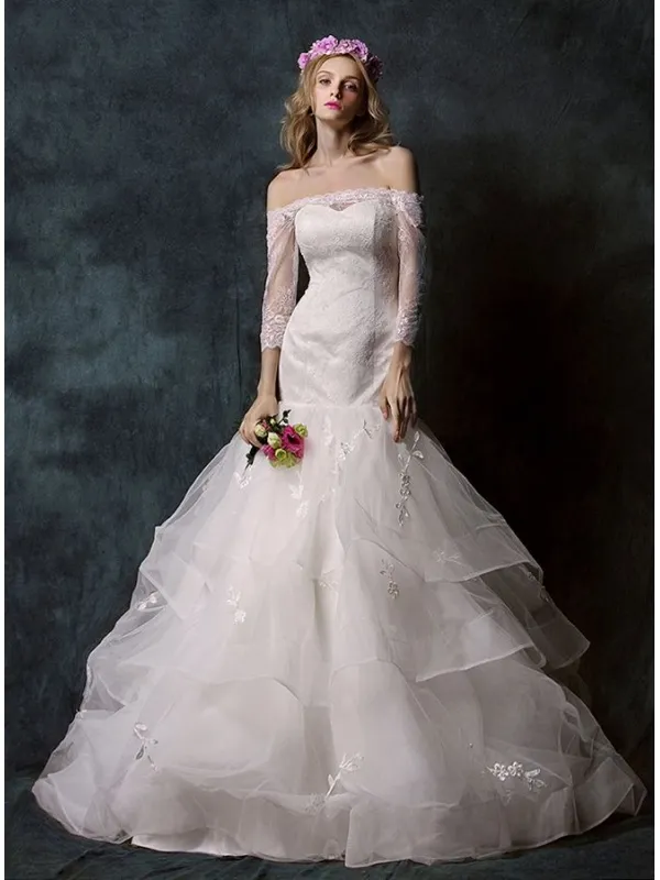 Abito da Sposa a Sirena con gonna vaporosa e corpetto in pizzo con scollo a barchetta