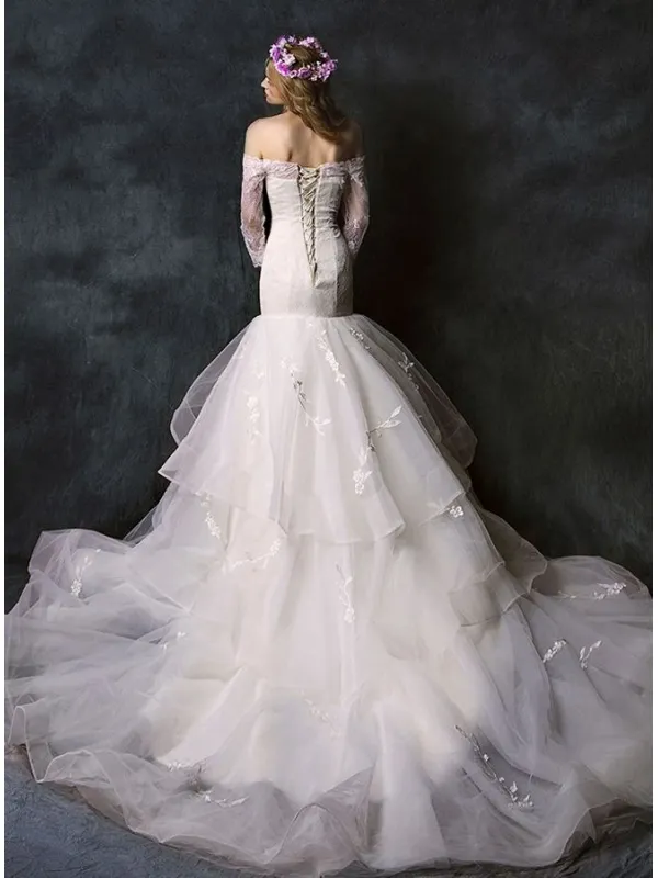 Abito da Sposa a Sirena con gonna vaporosa e corpetto in pizzo con scollo a barchetta
