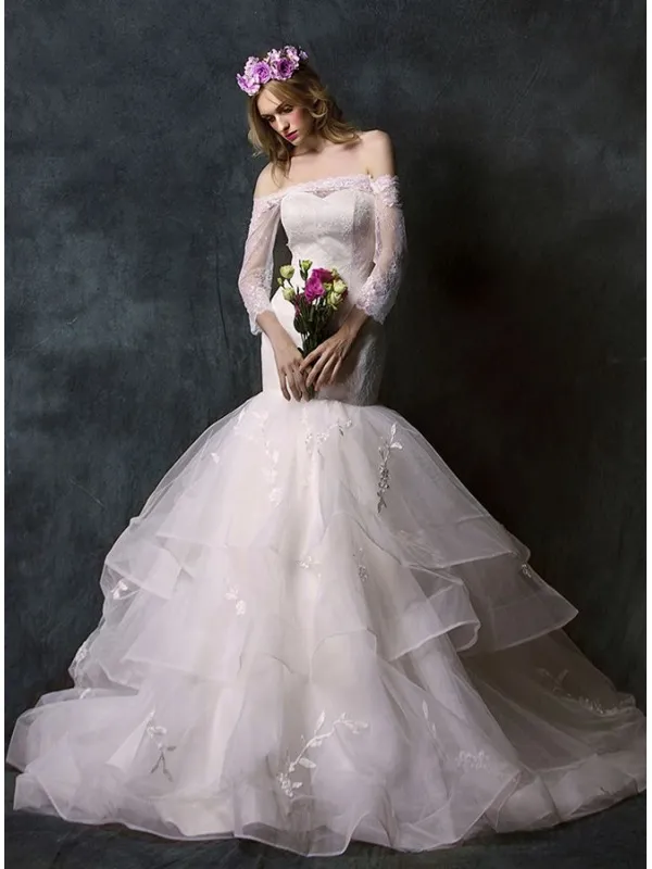 Abito da Sposa a Sirena con gonna vaporosa e corpetto in pizzo con scollo a barchetta