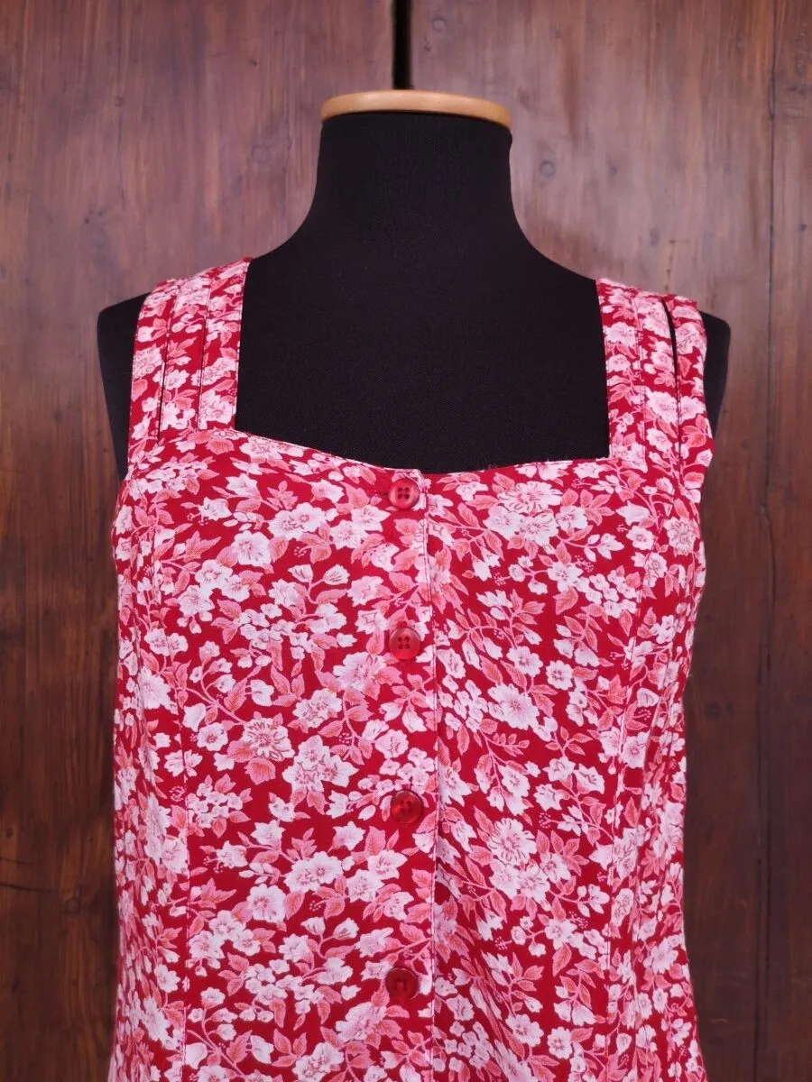 Abito rosso a fiori con spalline intrecciate