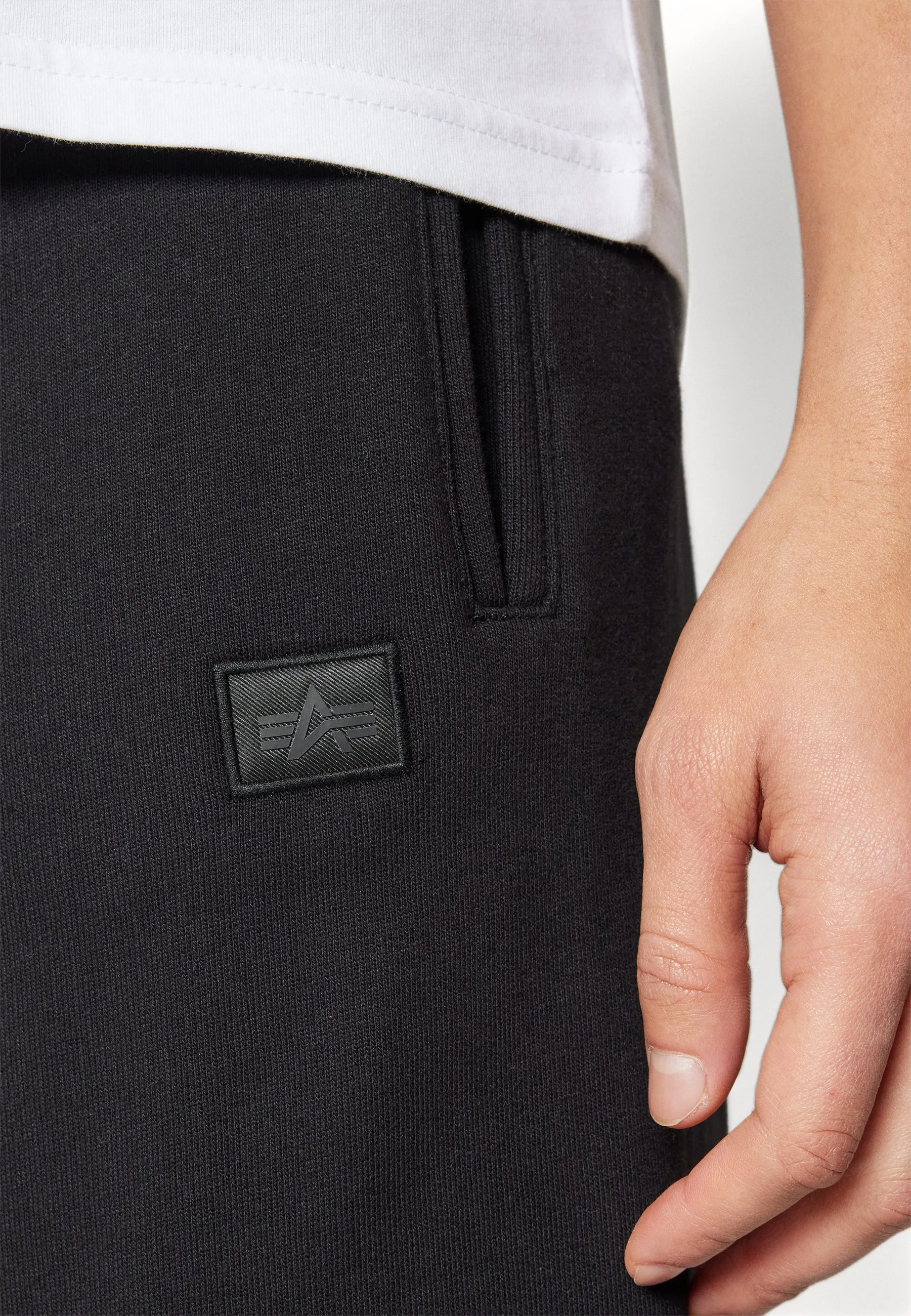 ALPHA ESSENTIALS JOGGER - Pantaloni sportivi