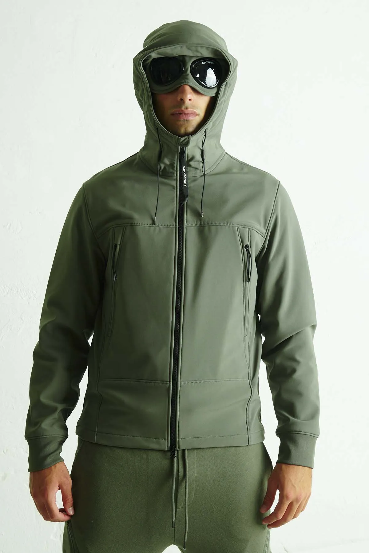 C.P. COMPANY Giubbotto in soft-shell con lenti nel cappuccio