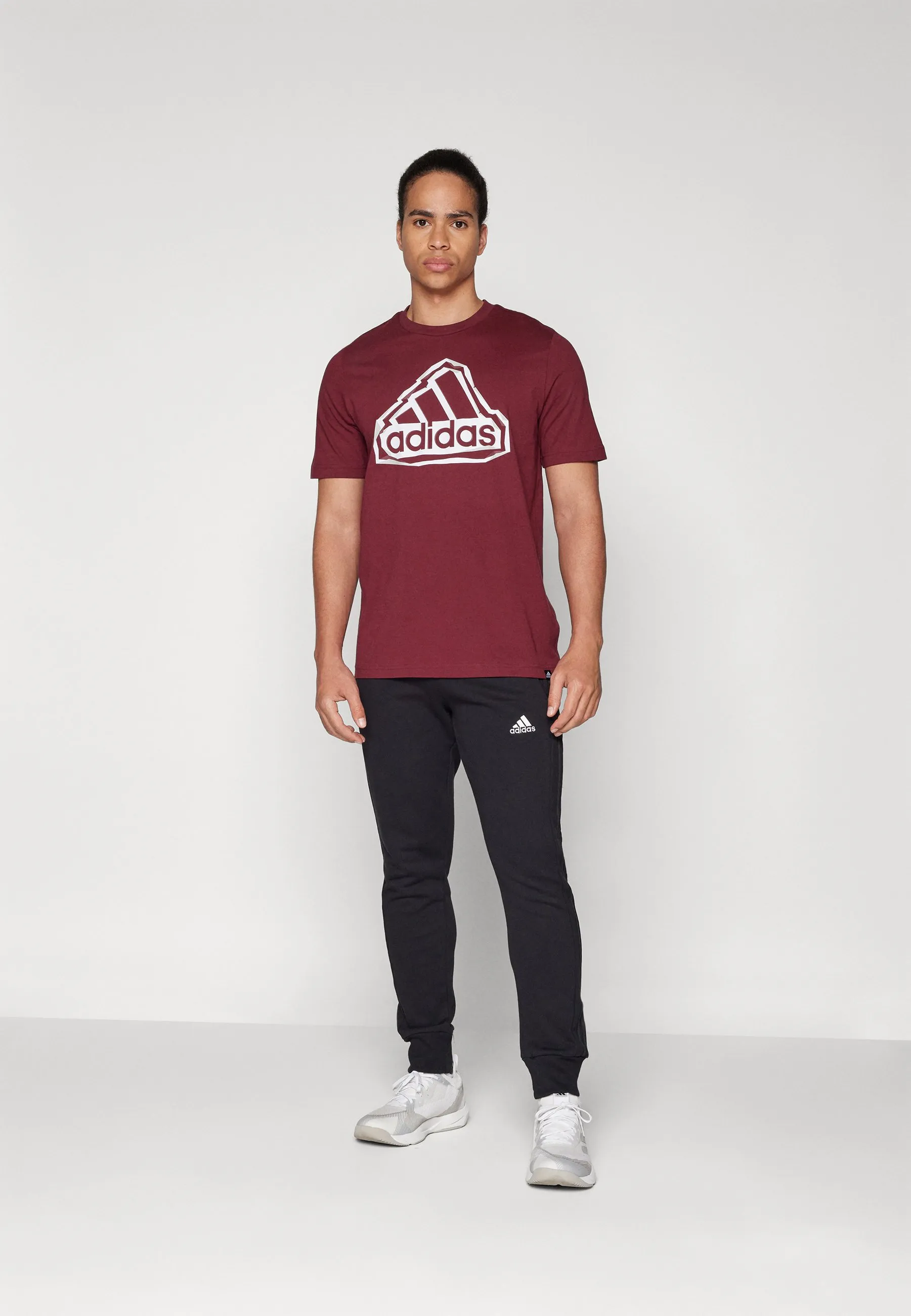 ESSENTIALS FRENCH TERRY TAPERED CUFF 3 STRIPES PANTS - Pantaloni sportivi