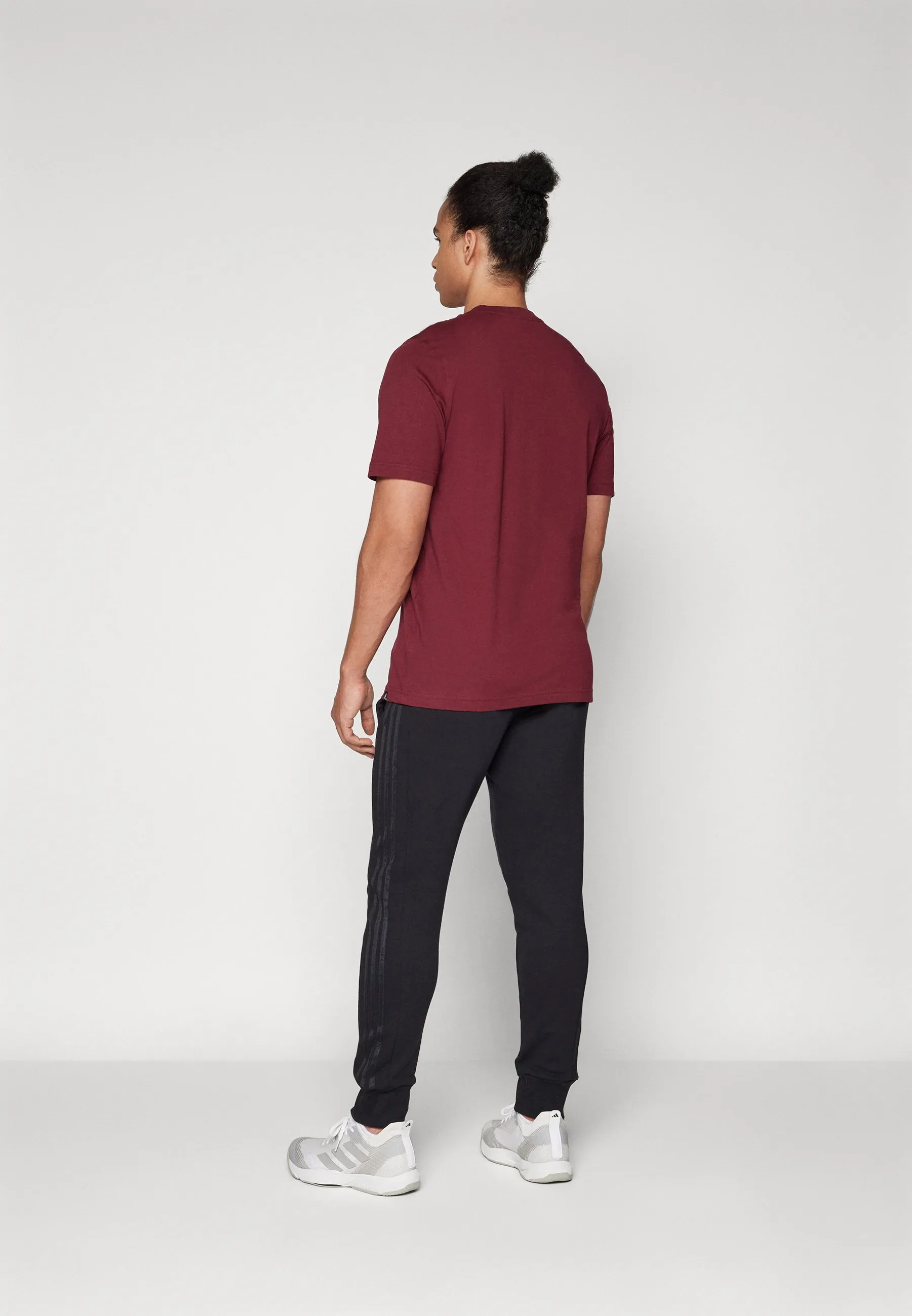 ESSENTIALS FRENCH TERRY TAPERED CUFF 3 STRIPES PANTS - Pantaloni sportivi