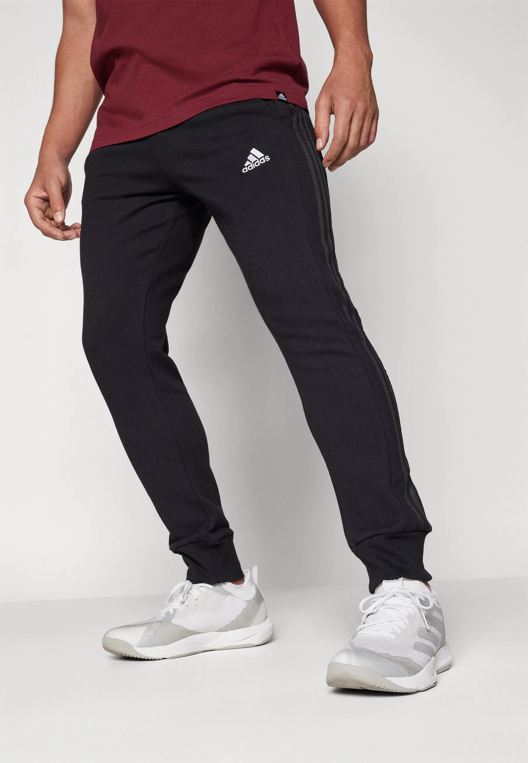 ESSENTIALS FRENCH TERRY TAPERED CUFF 3 STRIPES PANTS - Pantaloni sportivi